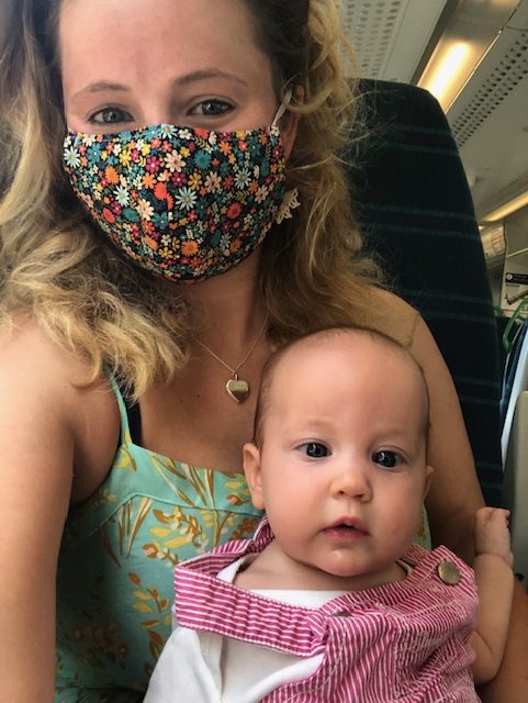 Eliza as a baby with Mummy on the train