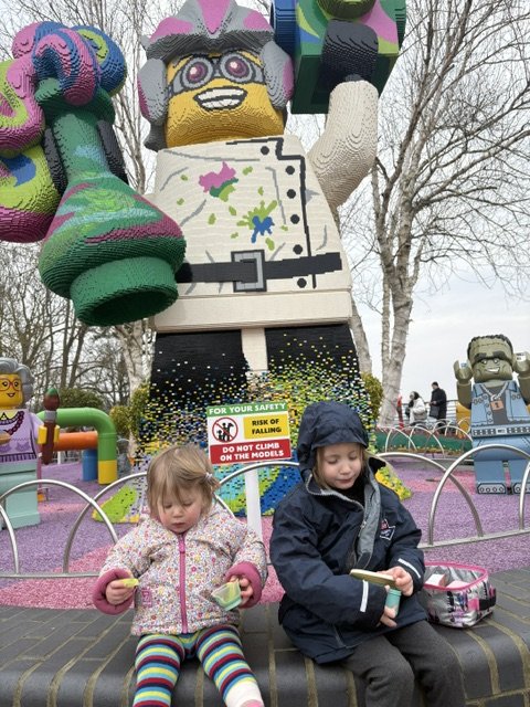 Cara and Eliza by the Lego statue