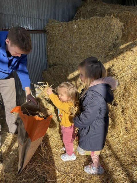 Cara and Eliza in the hay barn